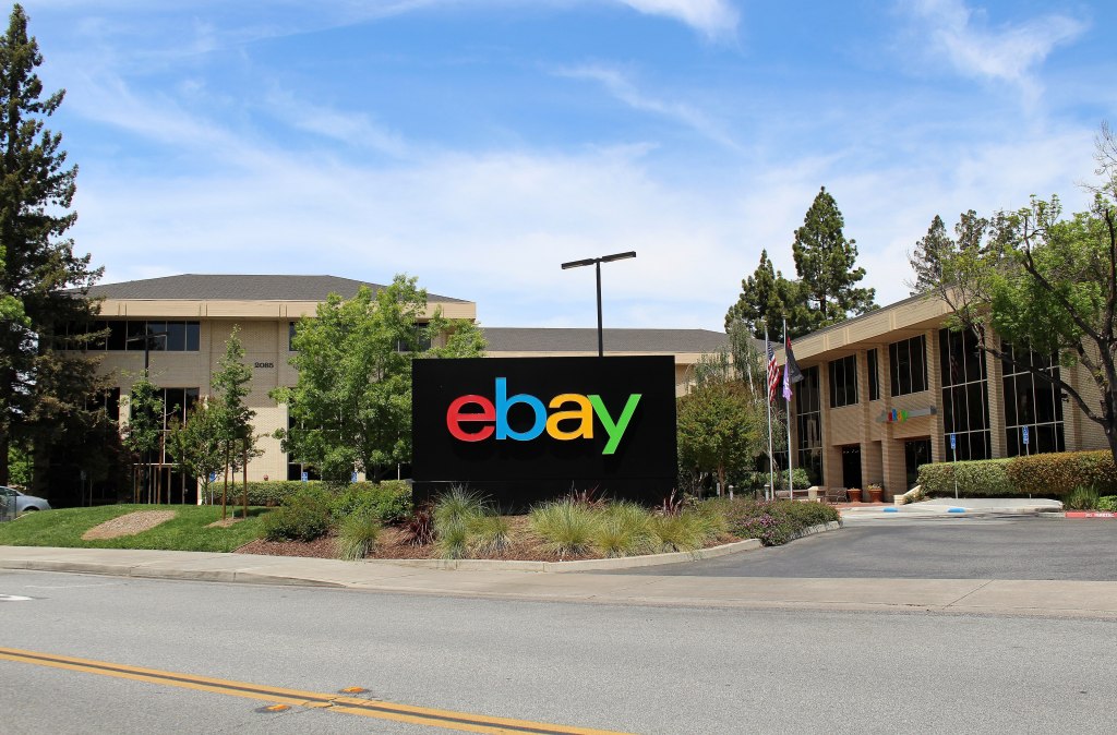 Low-rise eBay corporate headquarters buildings with the eBay logo on Hamilton Avenue in San Jose