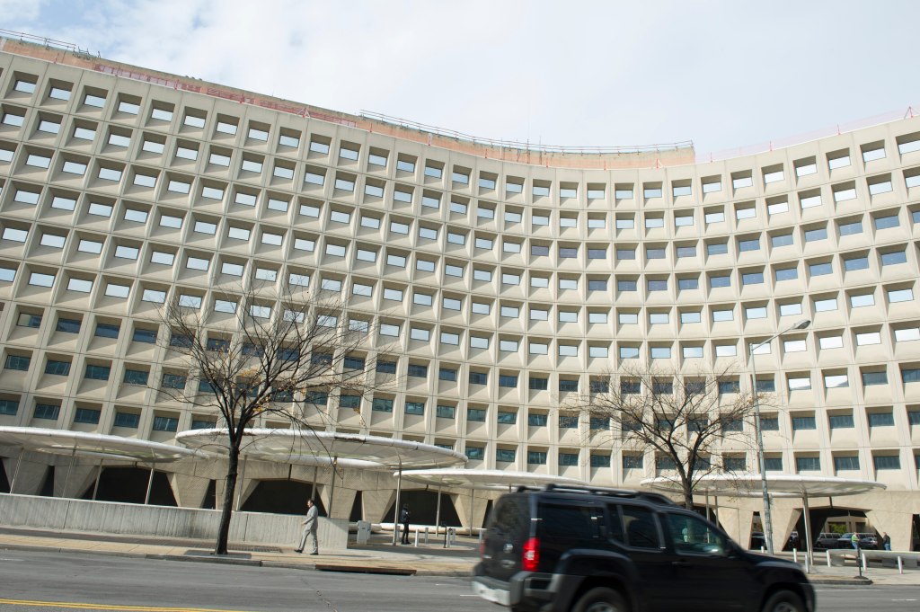 Exterior of the curved concrete Robert C. Weaver Federal Building, headquarters of the U.S. Department of Housing and Urban Development