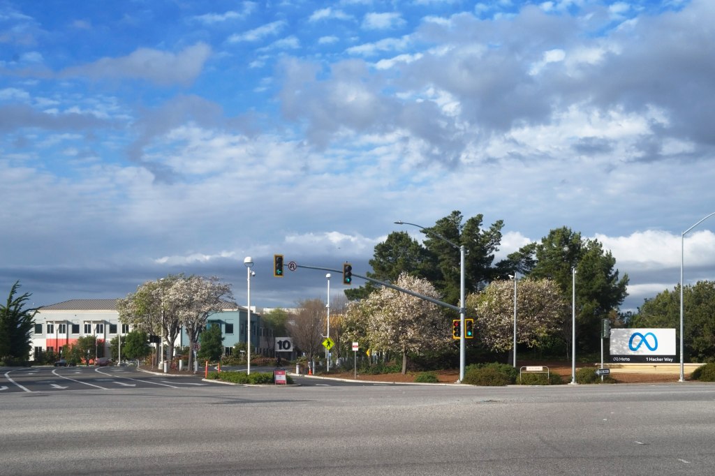 Entrance sign and landscaping at the Meta Platforms headquarters complex in Menlo Park, California