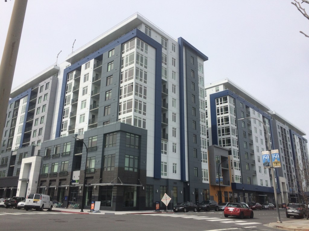 Multi-story residential buildings along a street in downtown Redwood City