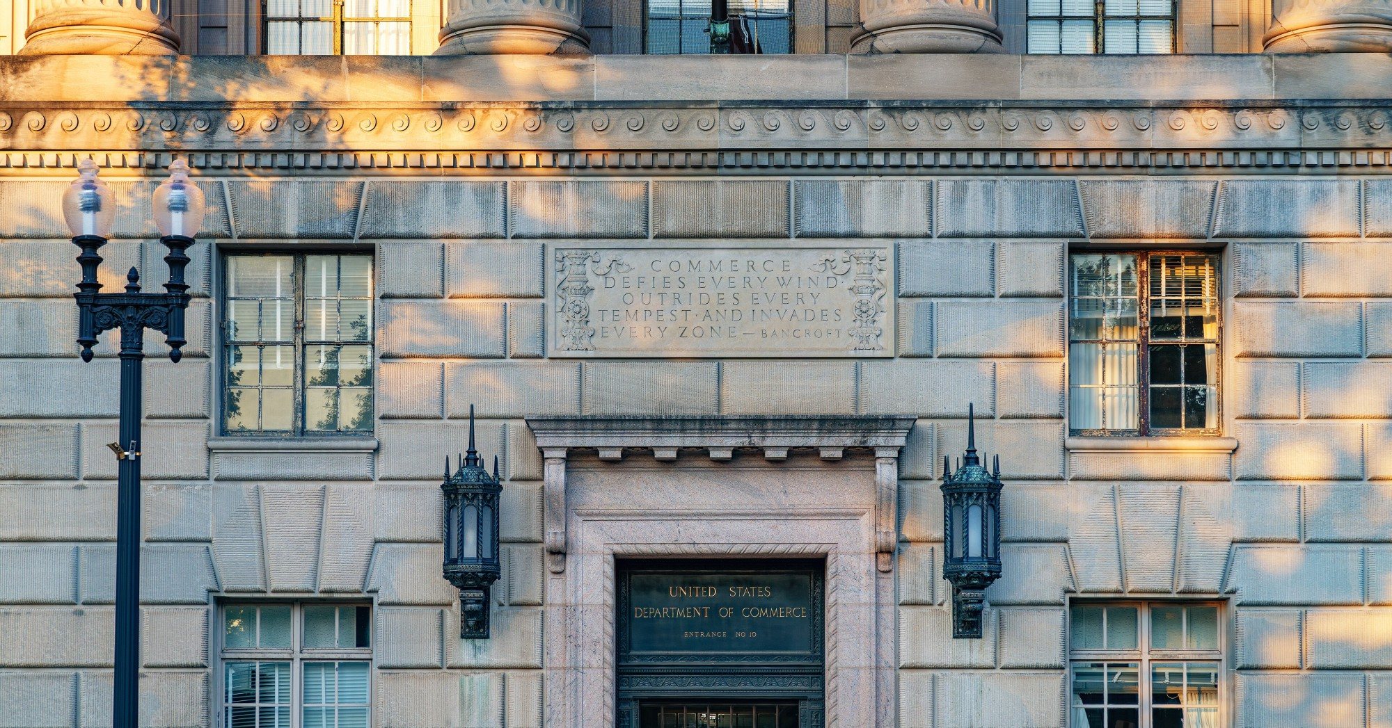 Stone facade and entrance of the Herbert C. Hoover Building, the Commerce Department headquarters in Washington